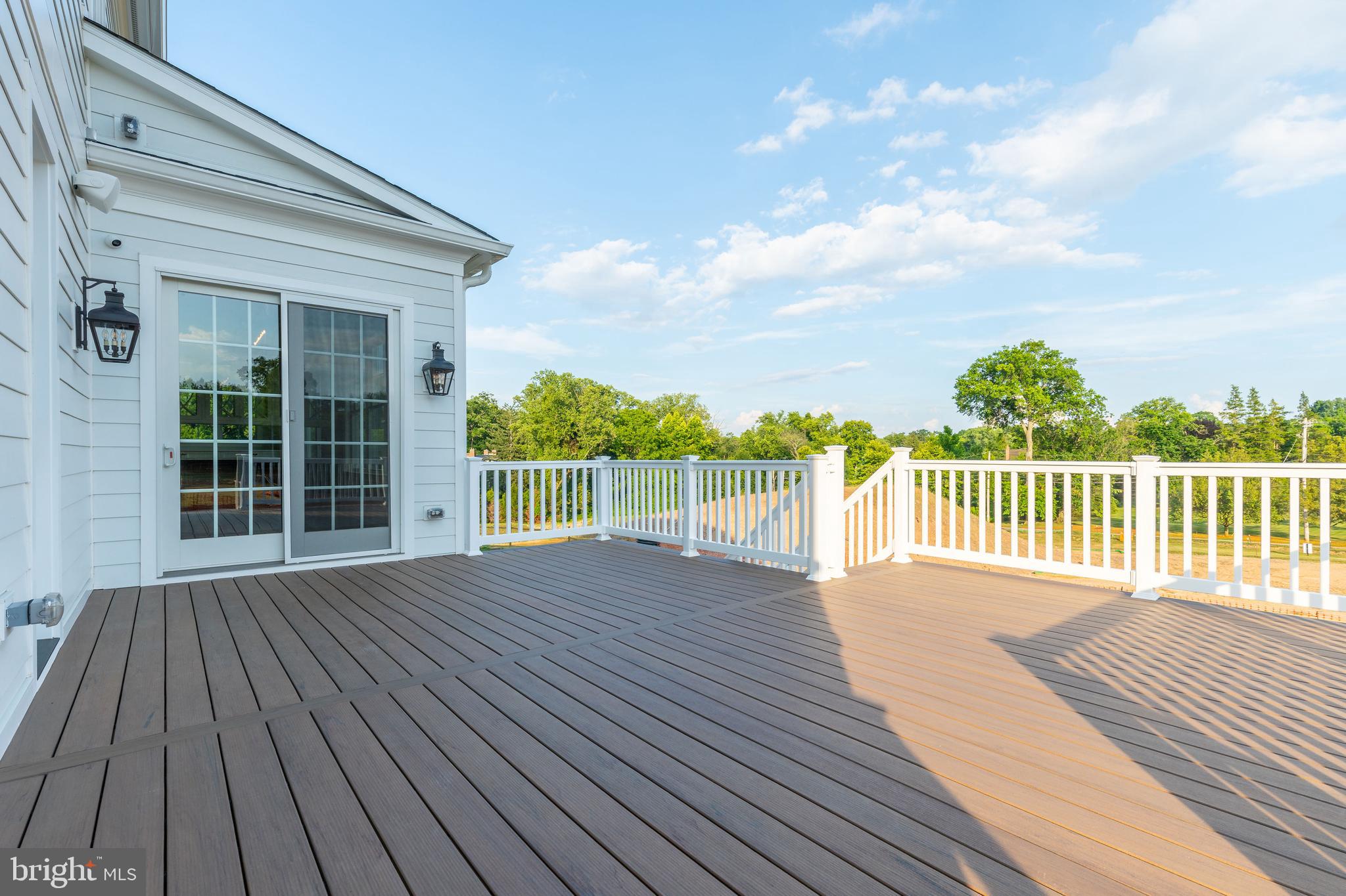 427 Radnor Street Road Wayne, PA 19087 - Photo 24 of 36 a view of a wooden deck with a yard