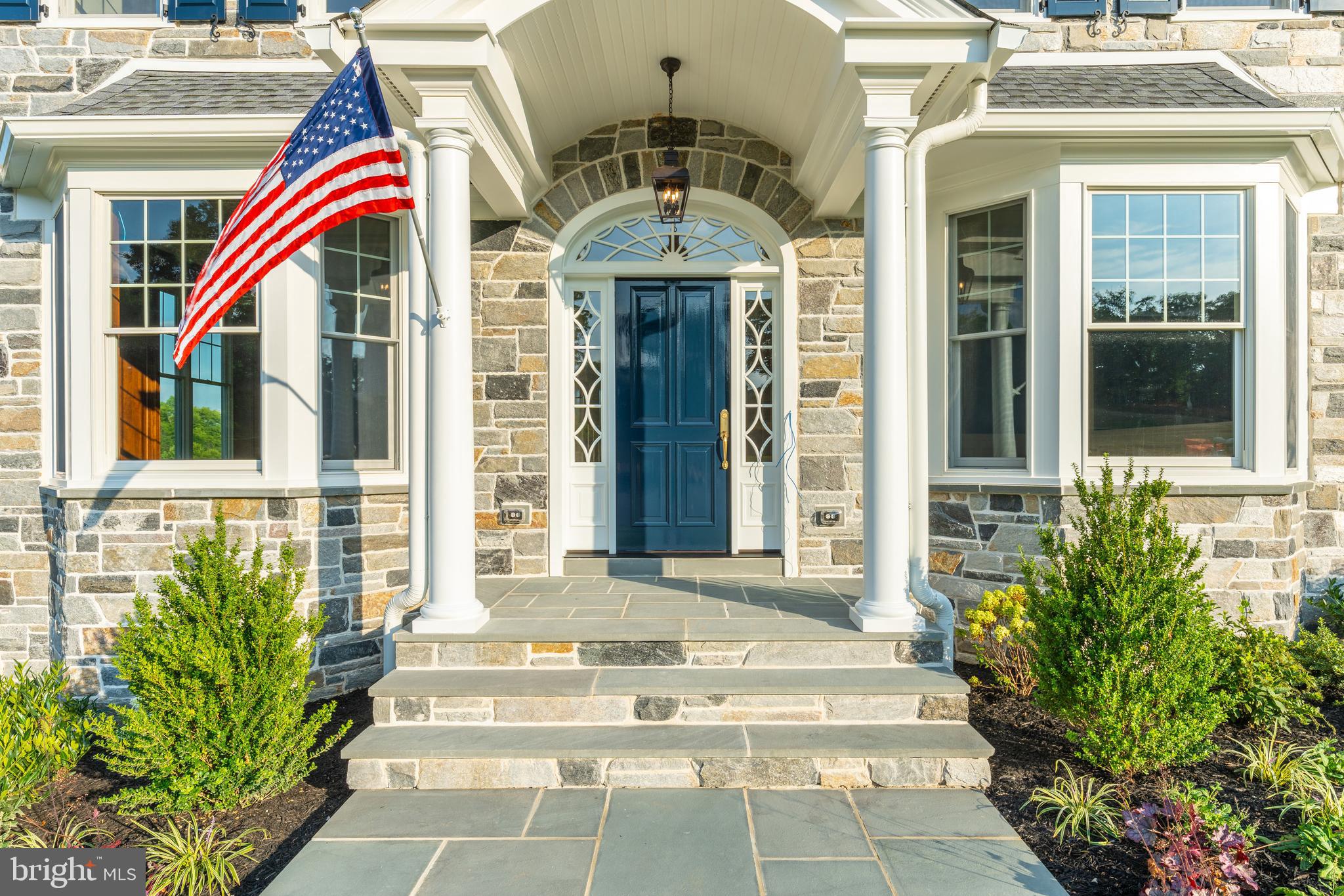 427 Radnor Street Road Wayne, PA 19087 - Photo 25 of 36 a front view of a house with large windows and a rug