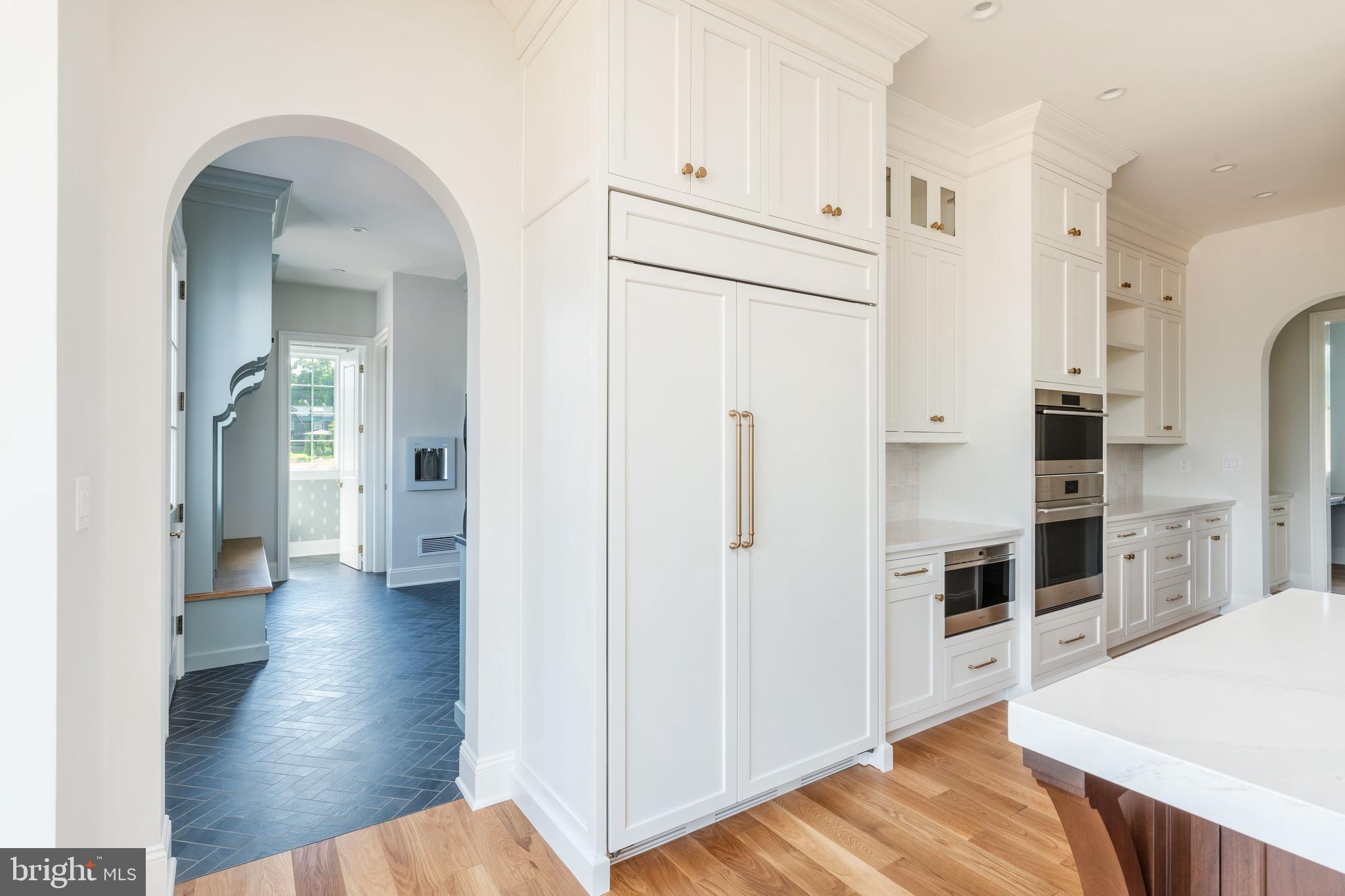 427 Radnor Street Road Wayne, PA 19087 - Photo 5 of 36 a view of a kitchen with refrigerator and wooden floor