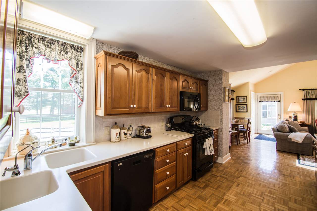 6389 Spring Creek Road Bridgewater, VA 22812 - Photo 23 of 41 a kitchen with a sink stove and cabinets