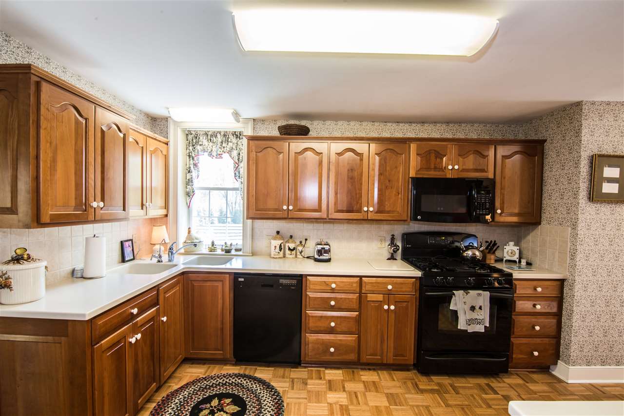 6389 Spring Creek Road Bridgewater, VA 22812 - Photo 25 of 41 a kitchen with a sink stove top oven and cabinets