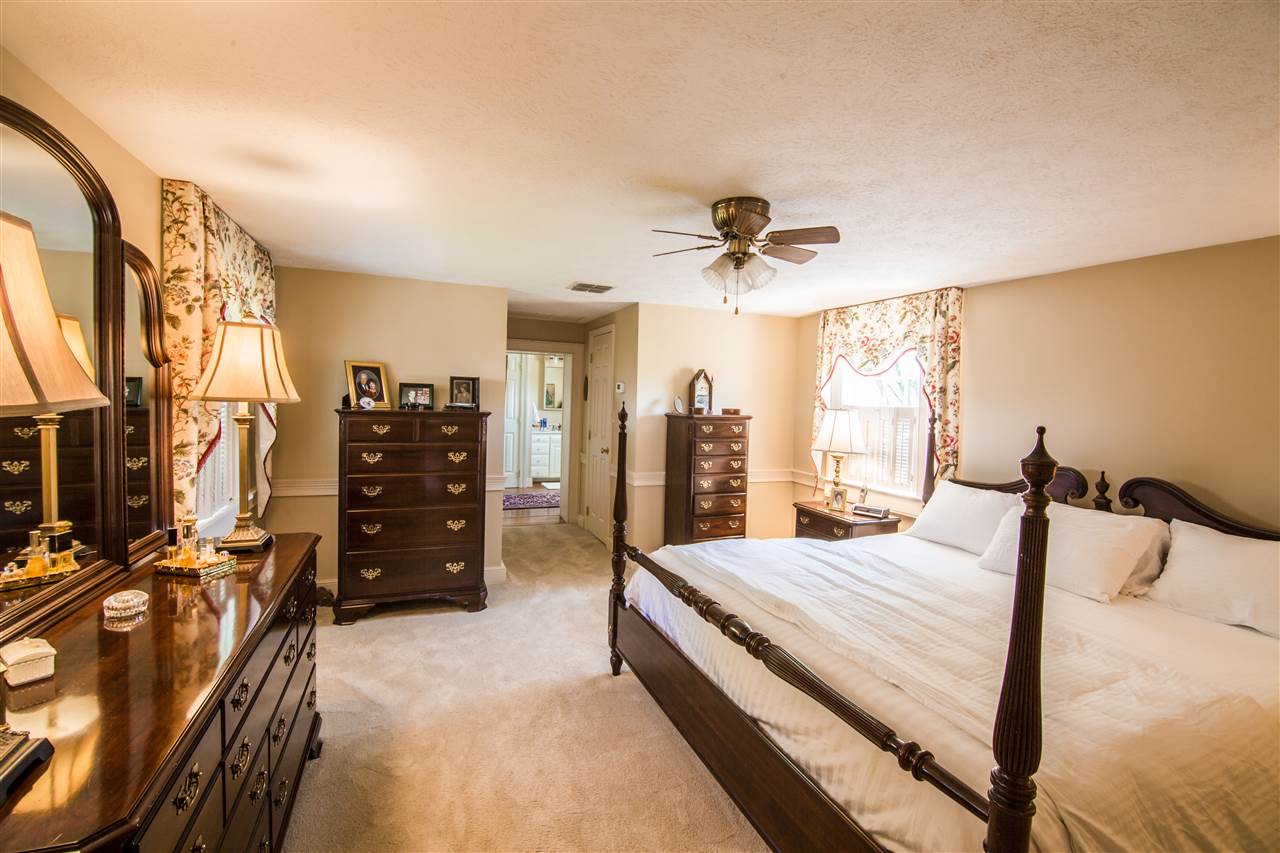 6389 Spring Creek Road Bridgewater, VA 22812 - Photo 33 of 41 a bedroom with a bed and ceiling fan