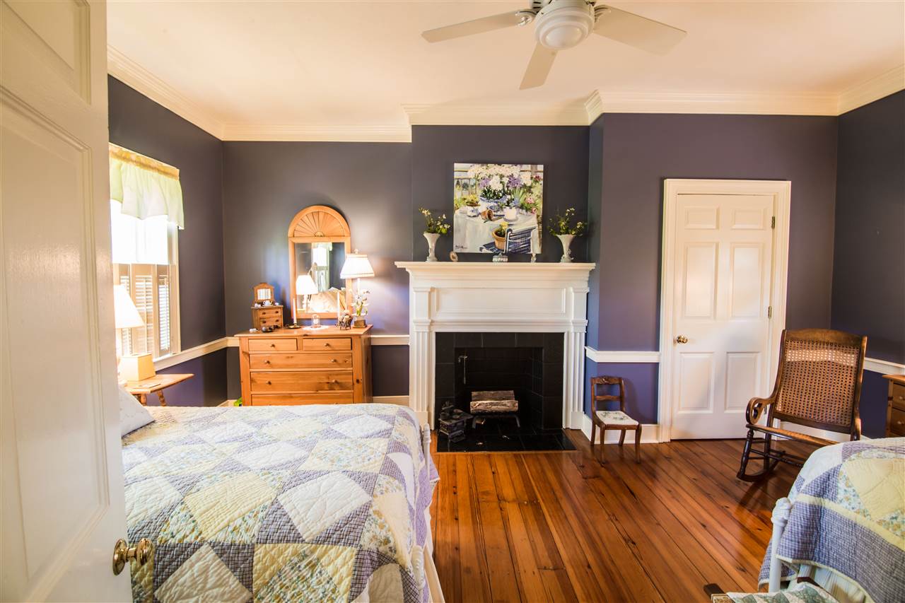 6389 Spring Creek Road Bridgewater, VA 22812 - Photo 38 of 41 a bedroom with a bed and a fireplace