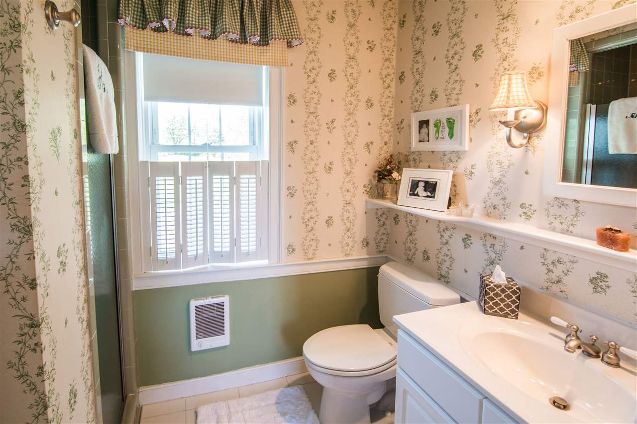 6389 Spring Creek Road Bridgewater, VA 22812 - Photo 41 of 41 a bathroom with a sink a toilet and a mirror