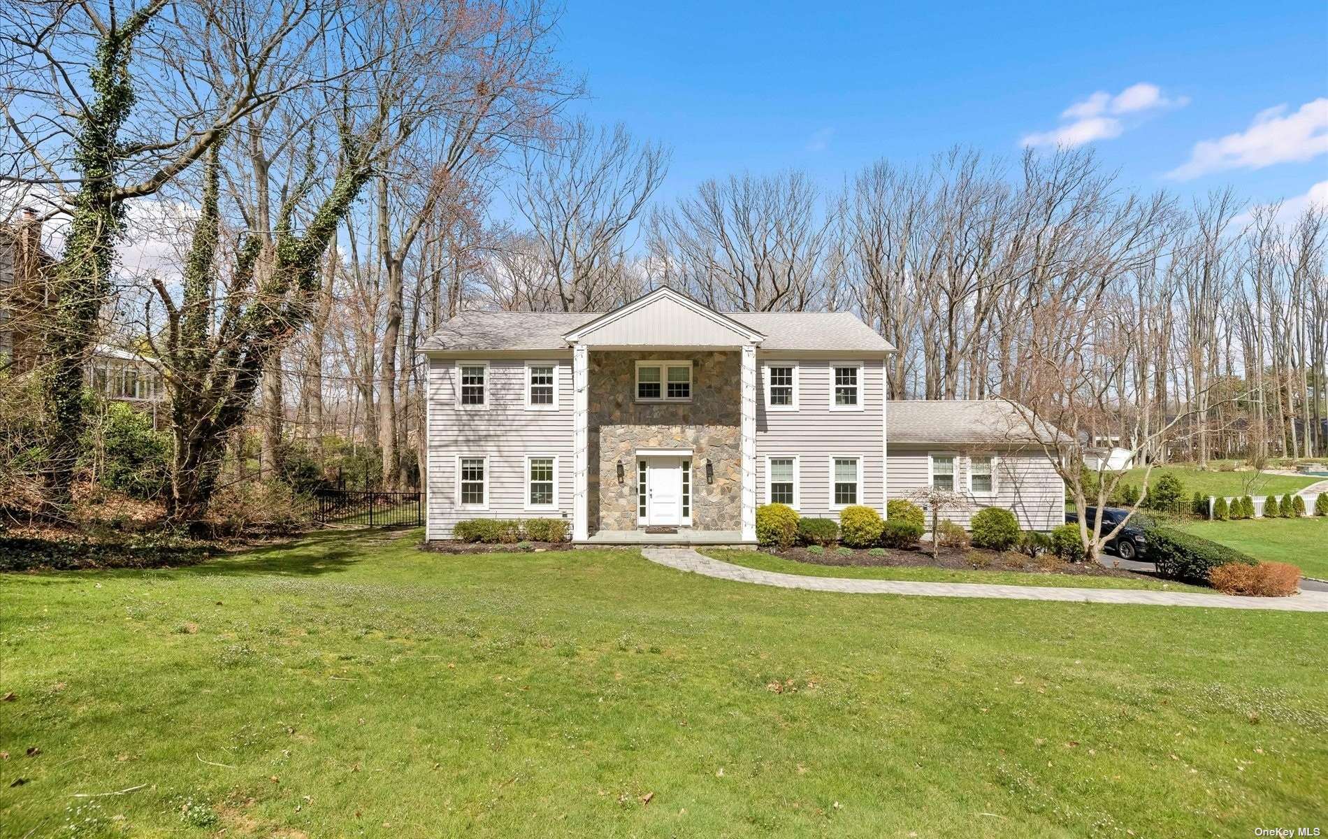 58 Orchard Drive Woodbury, NY 11797 - Photo 1 of 1 a front view of a house with a garden