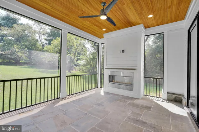 a view of a porch with wooden floor and outdoor space