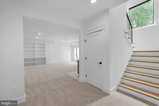 a view of room with stairs and a window