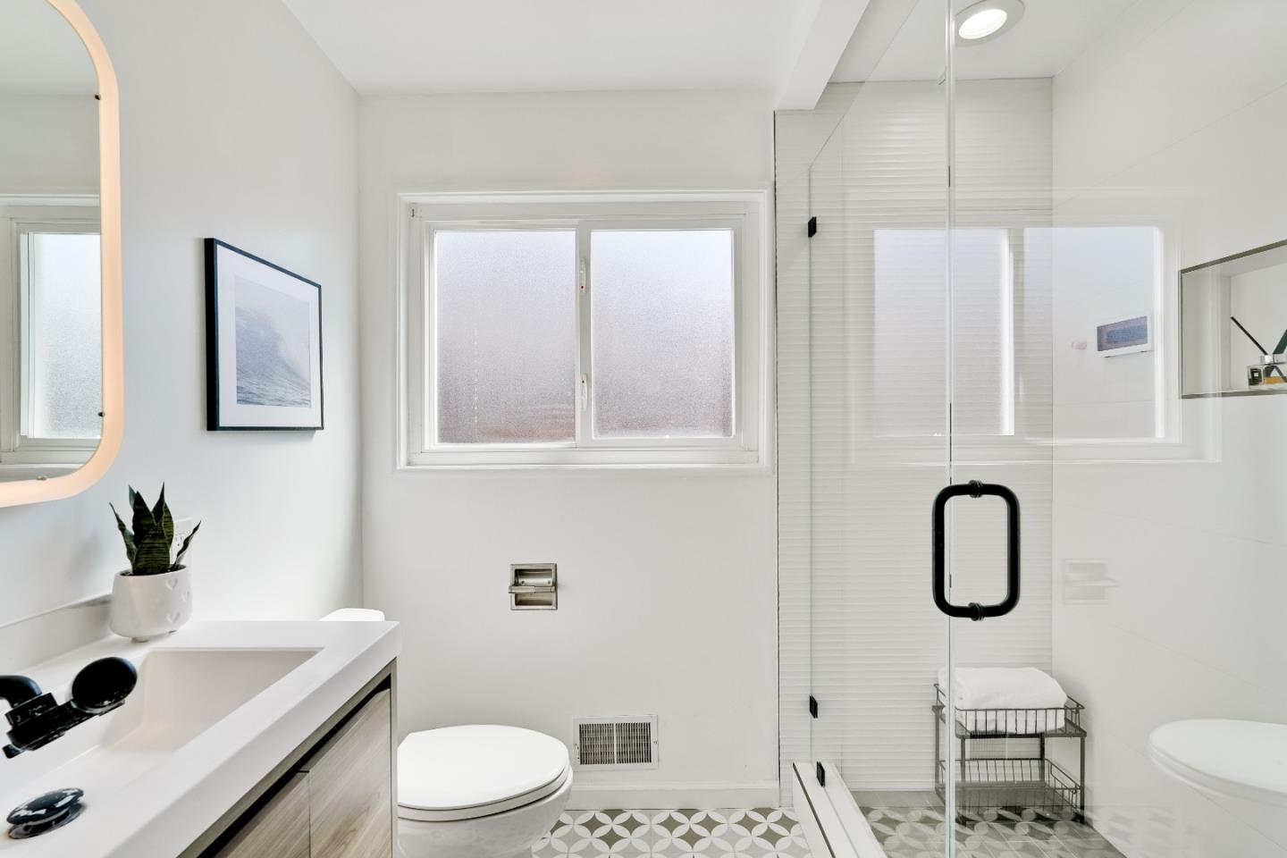 1755 Ravizza Avenue Santa Clara, CA 95051 - Photo 22 of 36 a bathroom with a sink toilet and shower