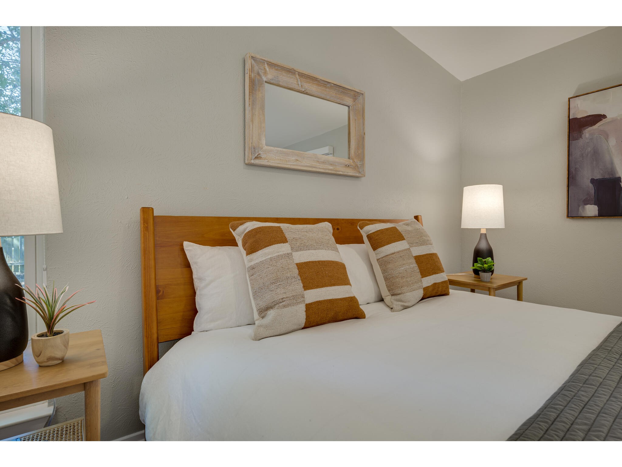 3203 Foster Lane Austin, TX 78757 - Photo 18 of 37 a bedroom with a bed and night stand