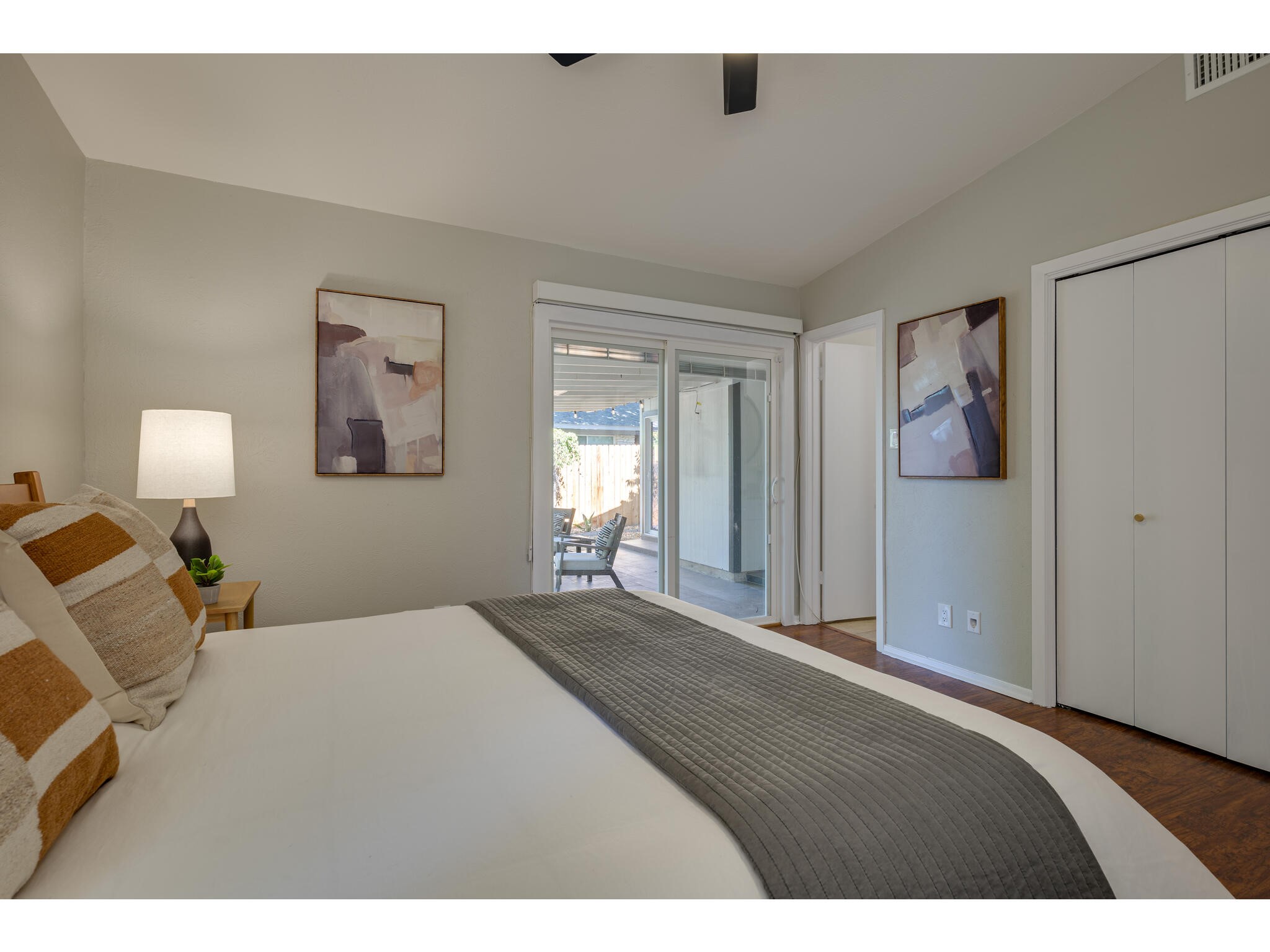 3203 Foster Lane Austin, TX 78757 - Photo 19 of 37 a bedroom with a bed and a lamp