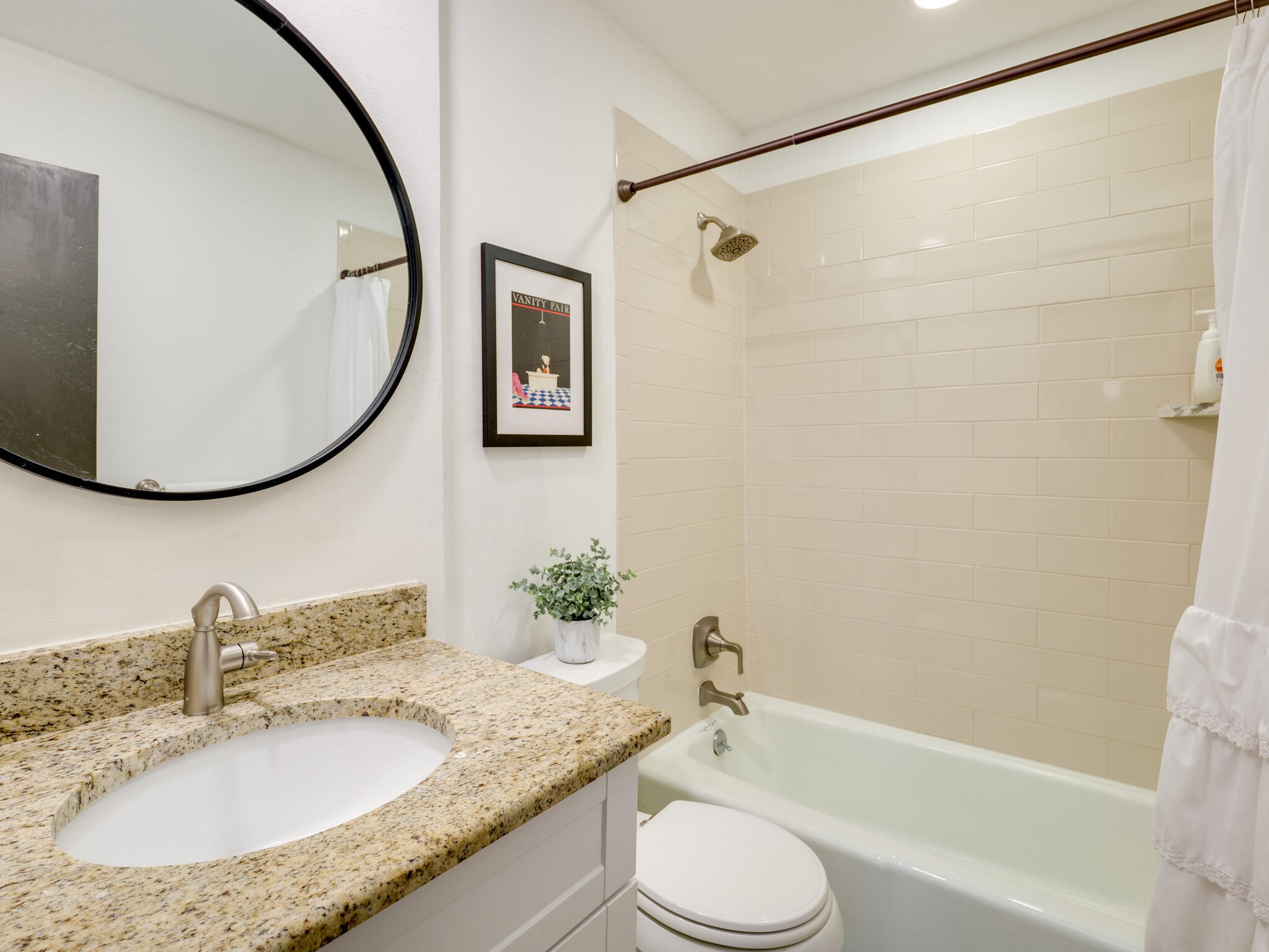 3203 Foster Lane Austin, TX 78757 - Photo 25 of 37 a bathroom with a granite countertop sink toilet and shower