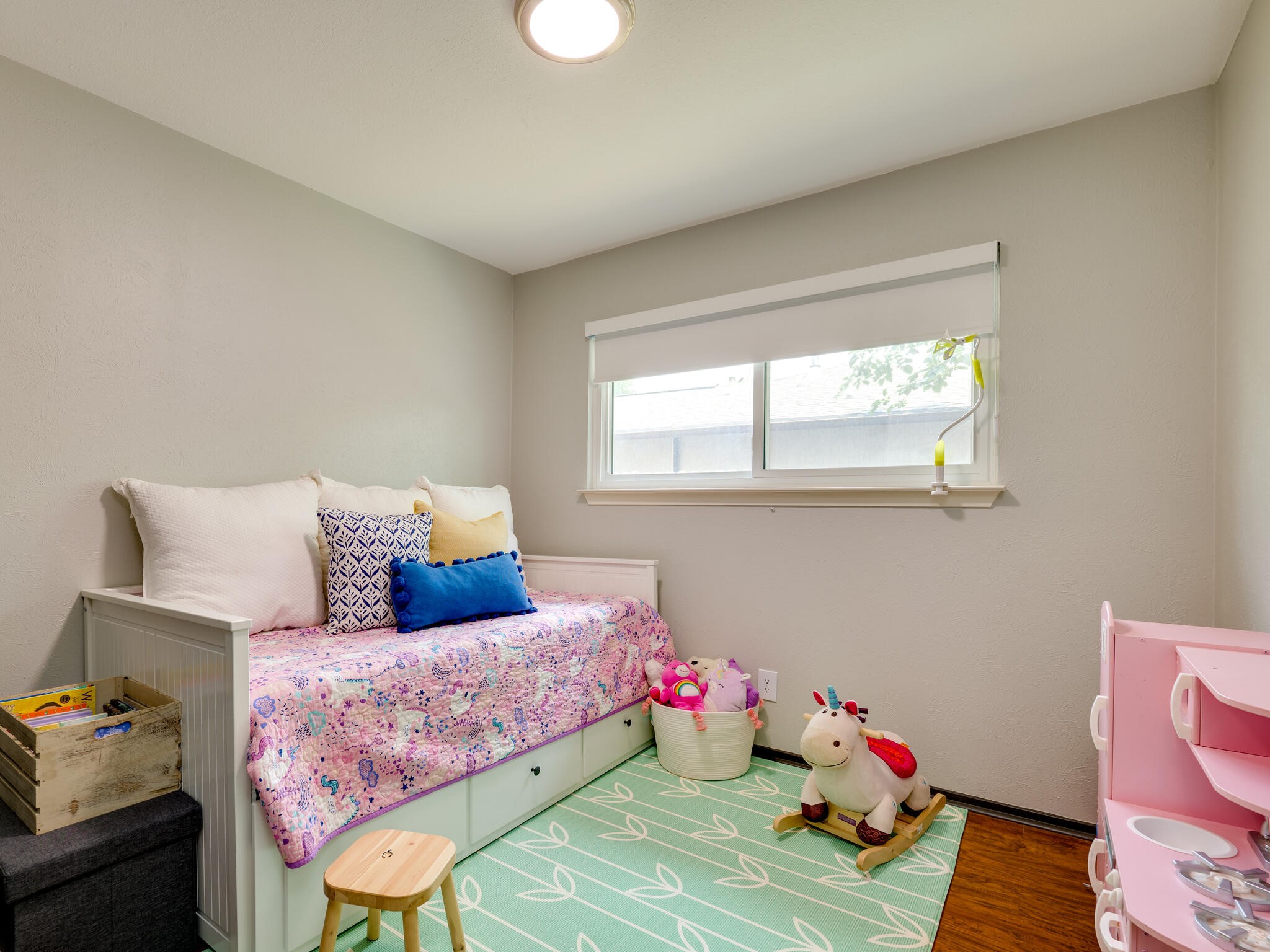 3203 Foster Lane Austin, TX 78757 - Photo 26 of 37 a bedroom with a bed and wooden floor