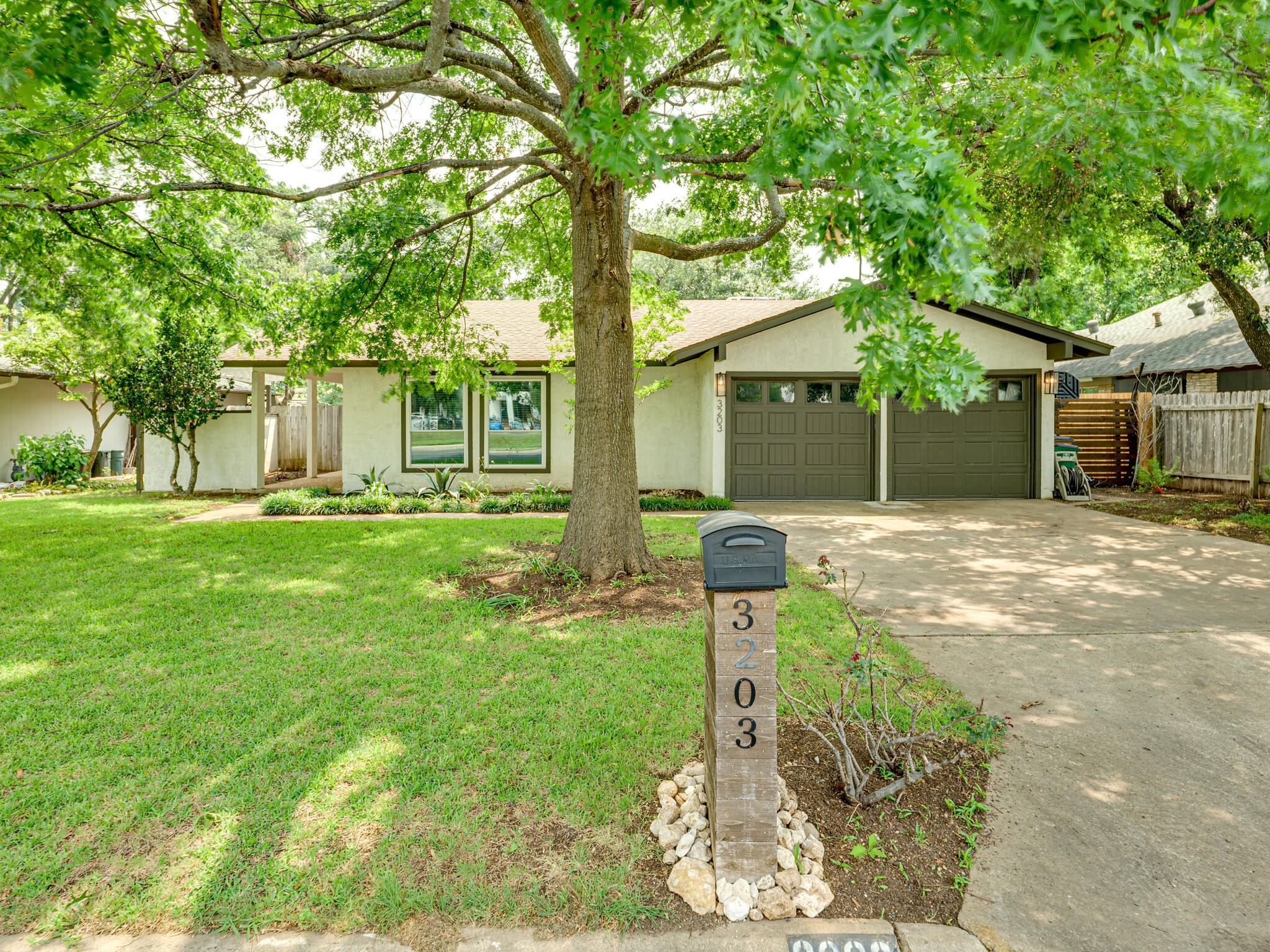 3203 Foster Lane Austin, TX 78757 - Photo 27 of 37 a front view of house with yard and green space