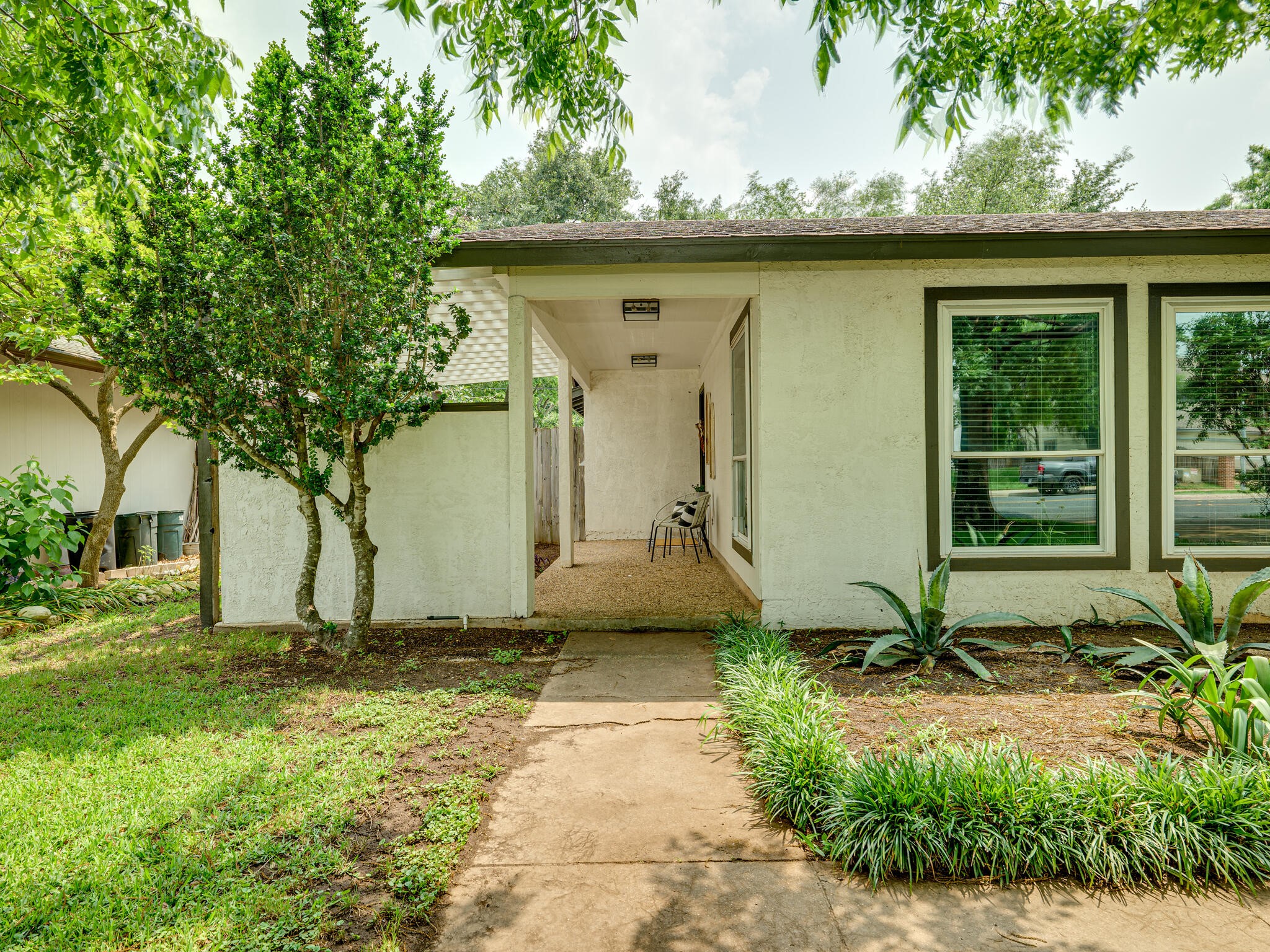 3203 Foster Lane Austin, TX 78757 - Photo 29 of 37 a front view of a house with garden