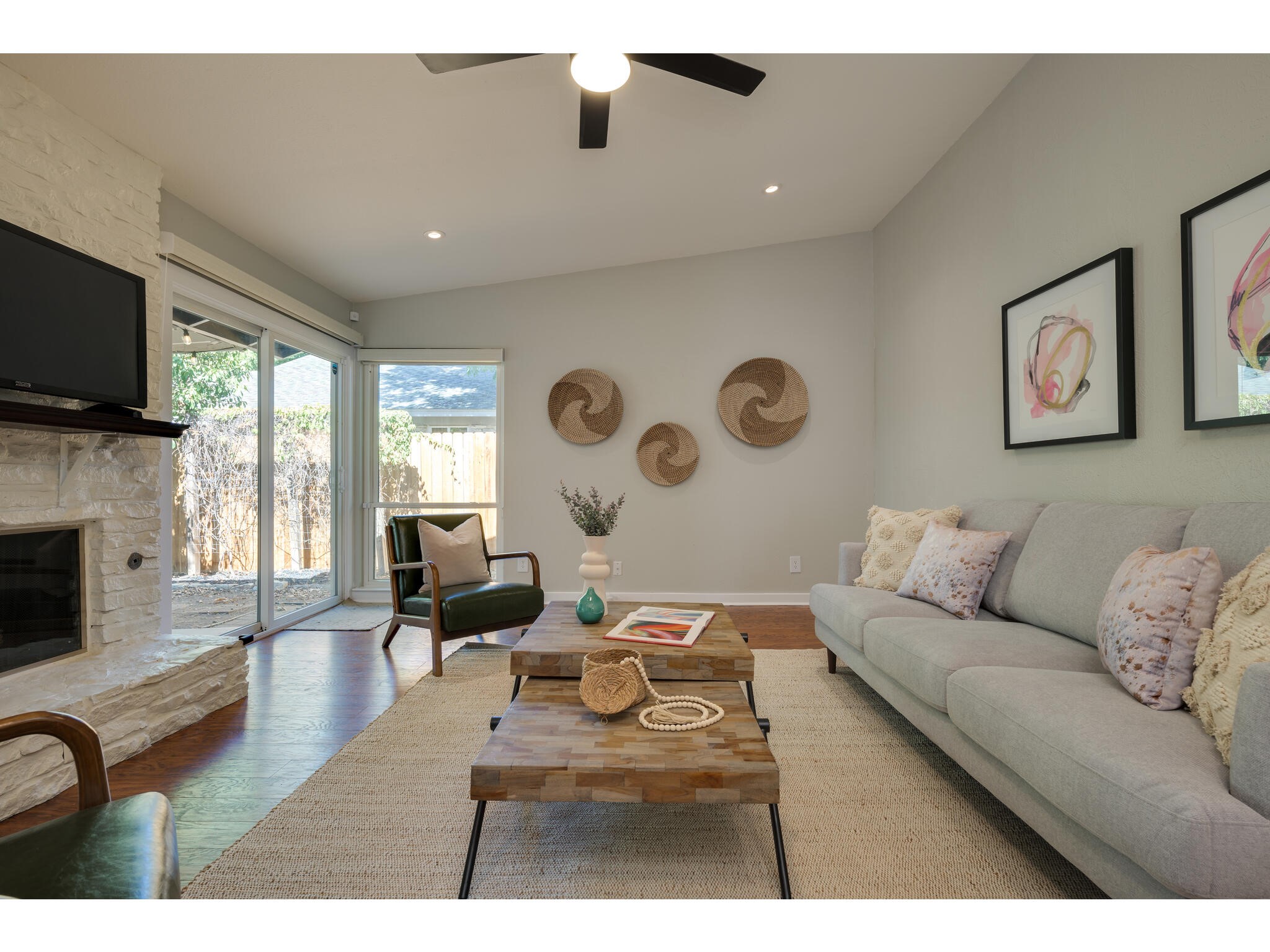 3203 Foster Lane Austin, TX 78757 - Photo 8 of 37 a living room with furniture flat screen tv and a fireplace