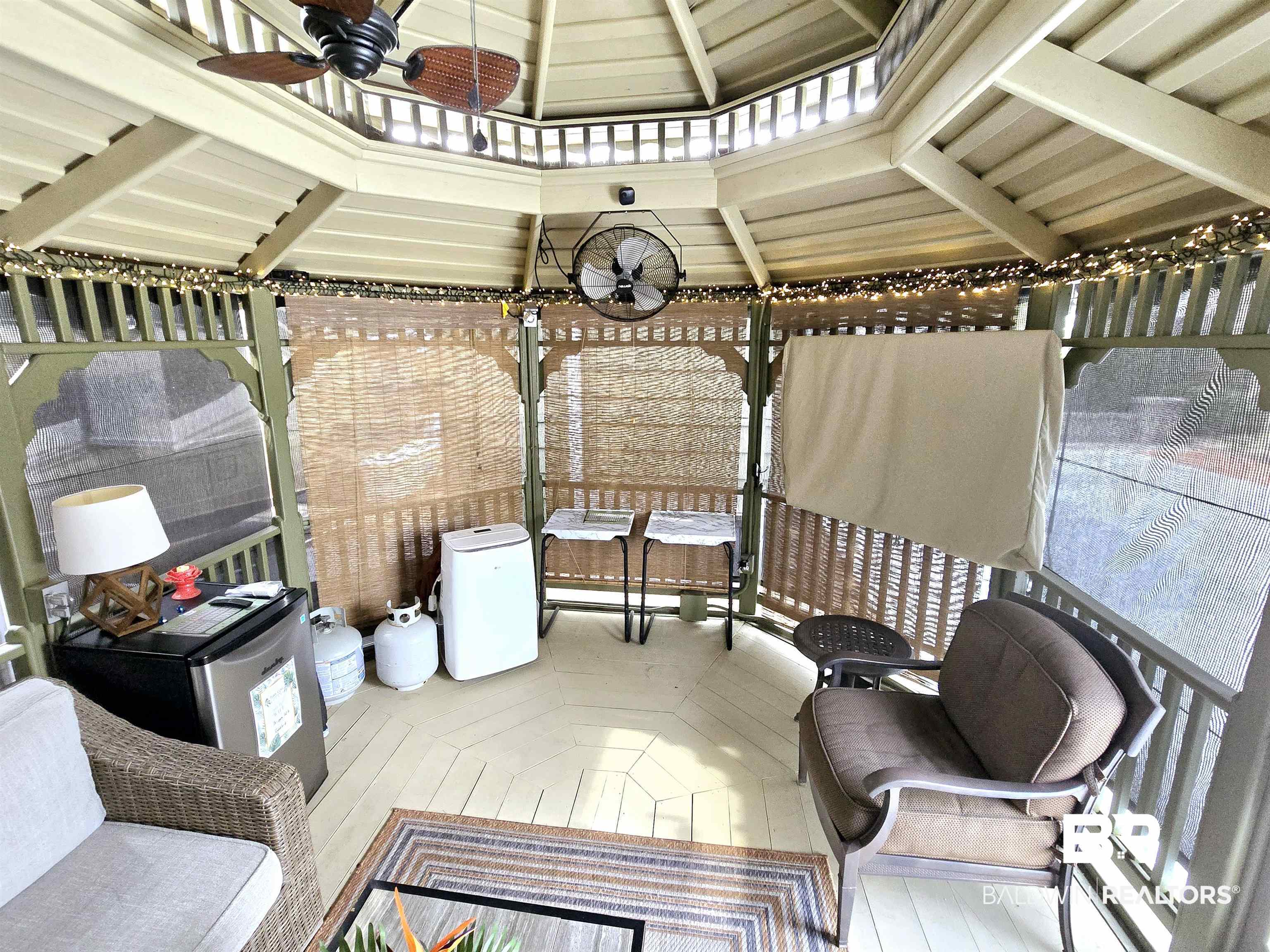 Wooden terrace featuring ceiling fan