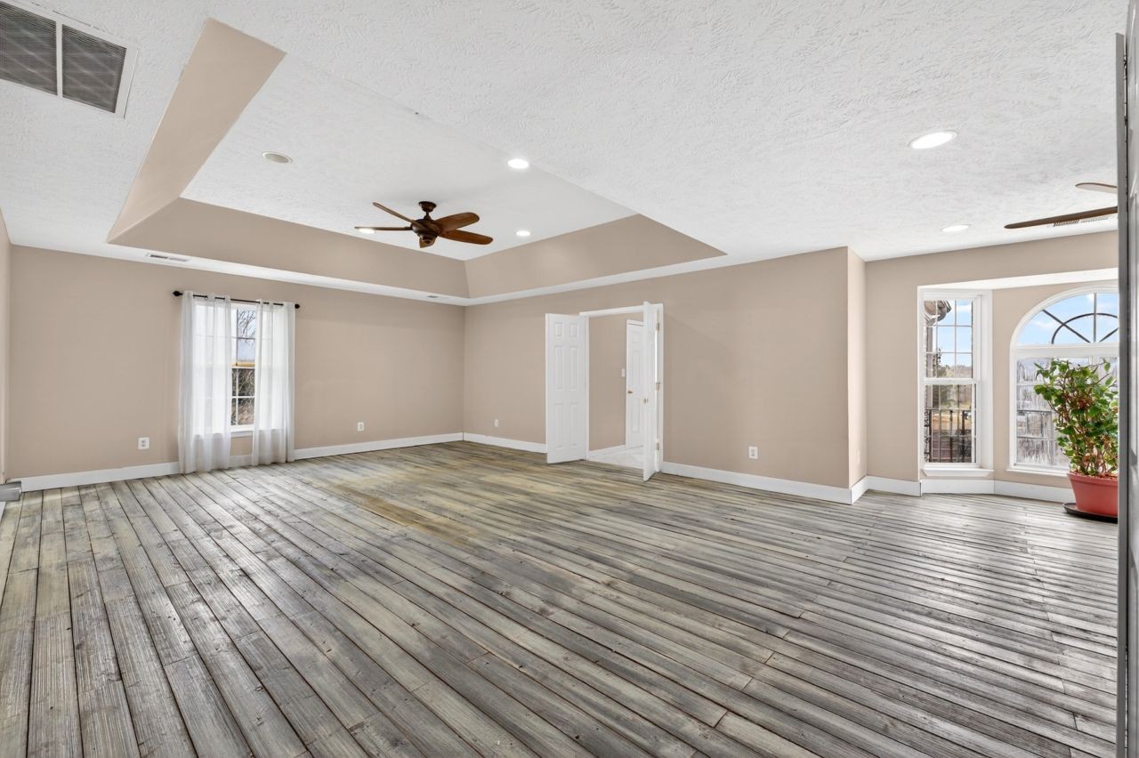 1463 B Vesta Road Lebanon, TN 37090 - Photo 40 of 86 a view of an empty room with wooden floor and a window