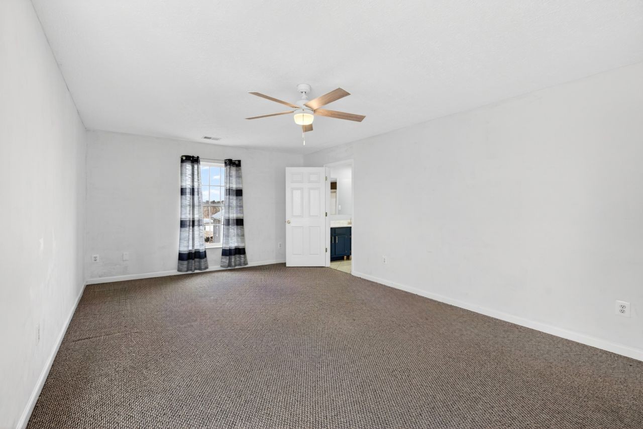 1463 B Vesta Road Lebanon, TN 37090 - Photo 52 of 86 an empty room with closet and windows