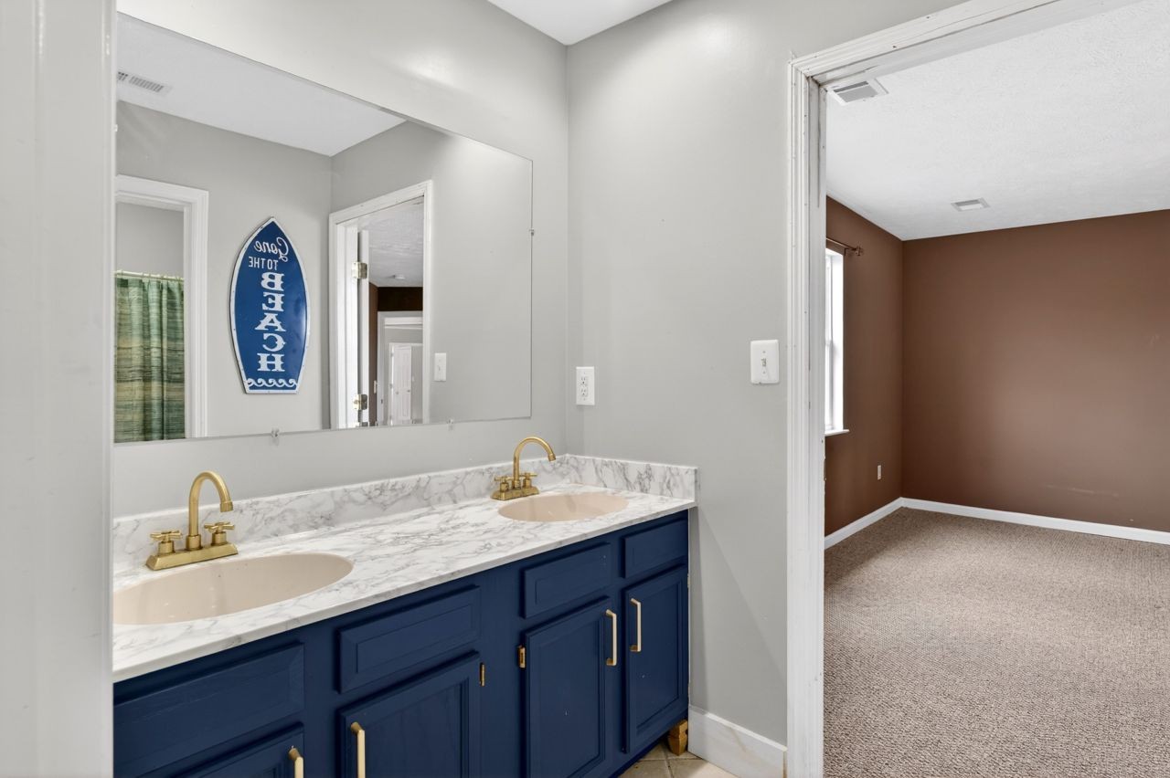 1463 B Vesta Road Lebanon, TN 37090 - Photo 53 of 86 a bathroom with a double vanity sink and a mirror