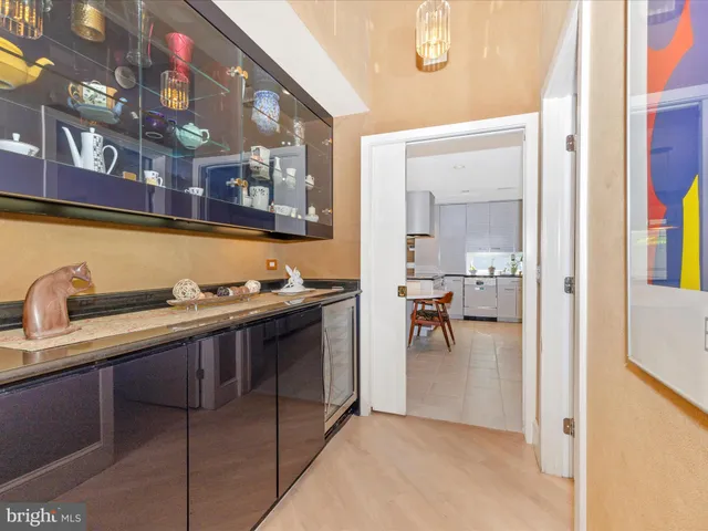a kitchen with a sink and white cabinets