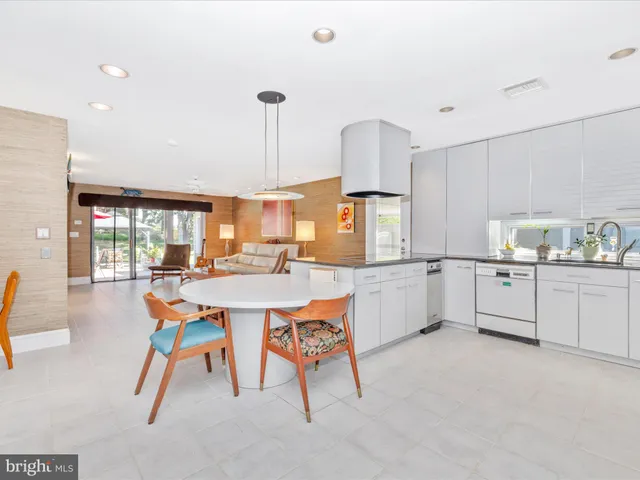 a kitchen with granite countertop cabinets and refrigerator