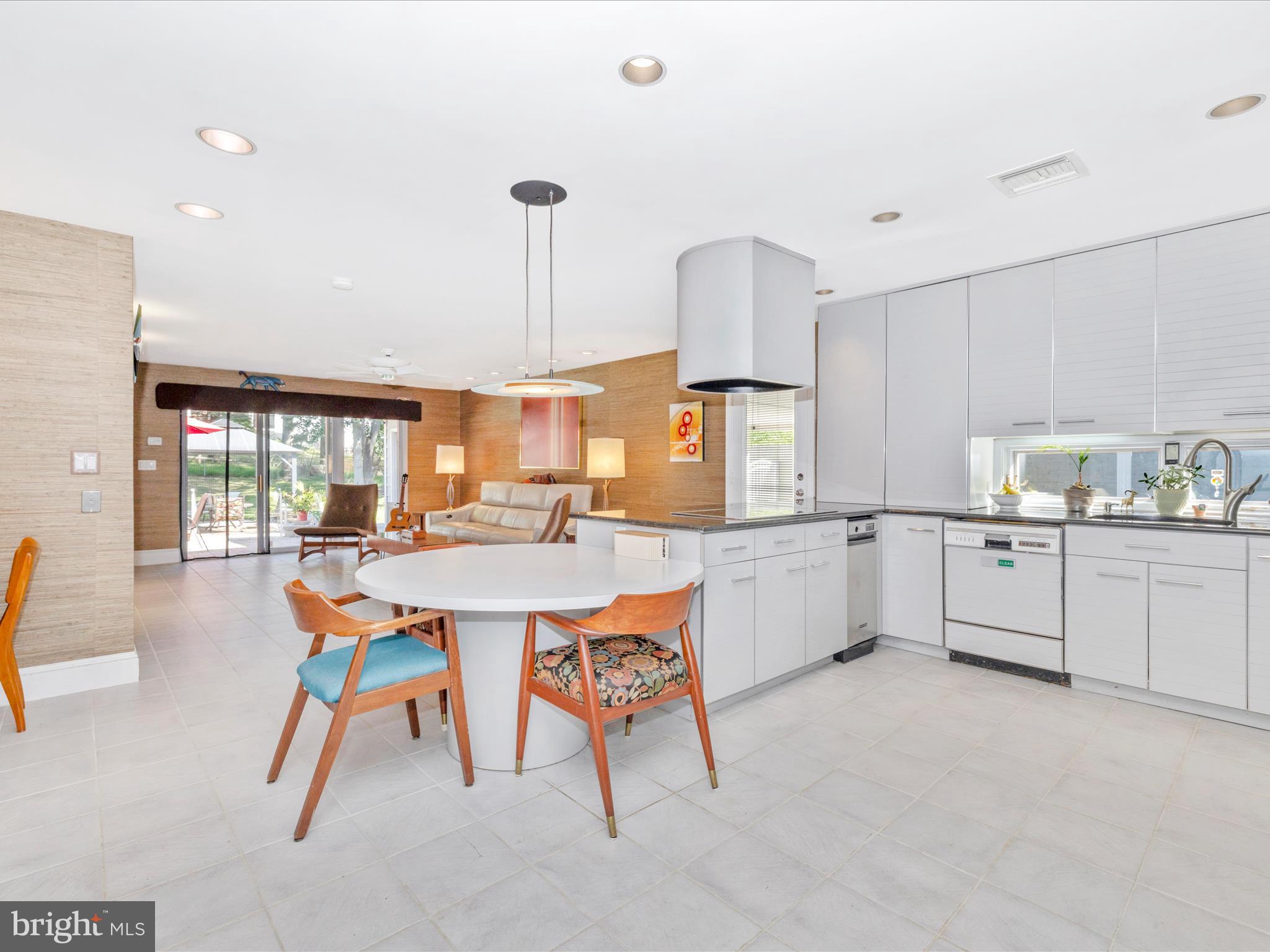 8207 Marcie Drive Baltimore, MD 21208 - Photo 22 of 67 a kitchen with a sink and white cabinets