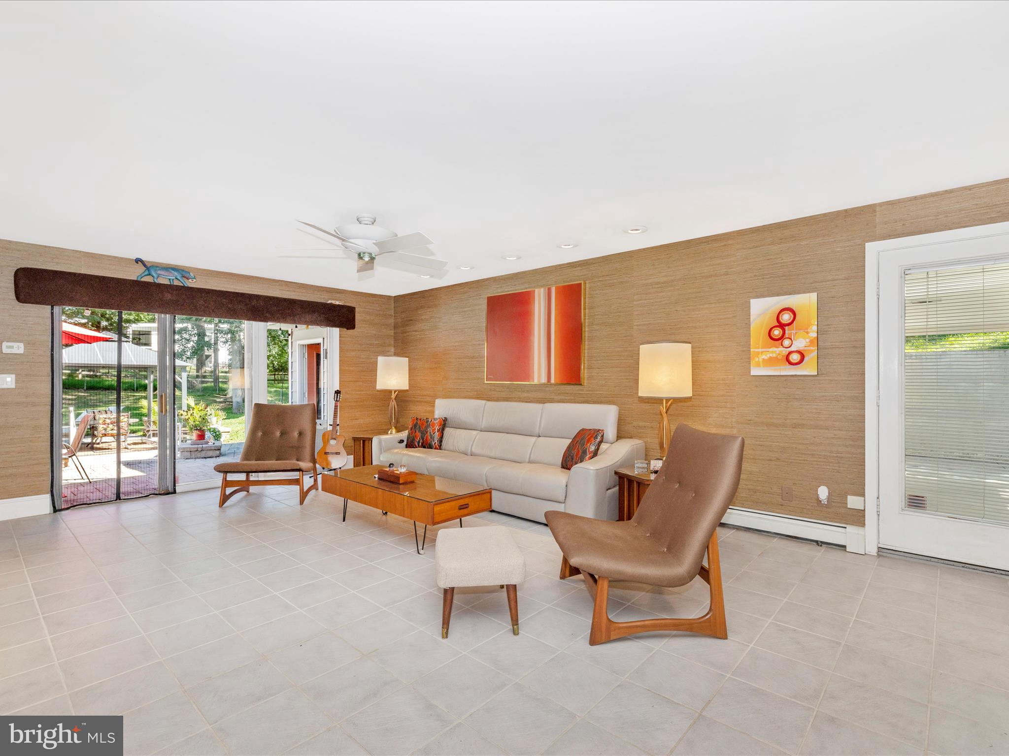 8207 Marcie Drive Baltimore, MD 21208 - Photo 26 of 67 a living room with furniture and a large window