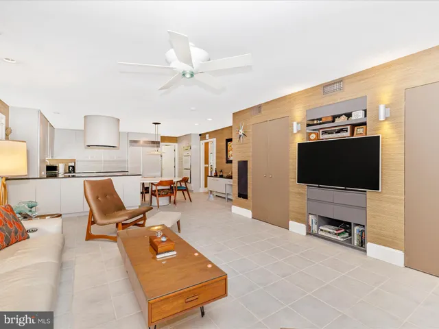a bedroom with a large bed and a flat screen tv