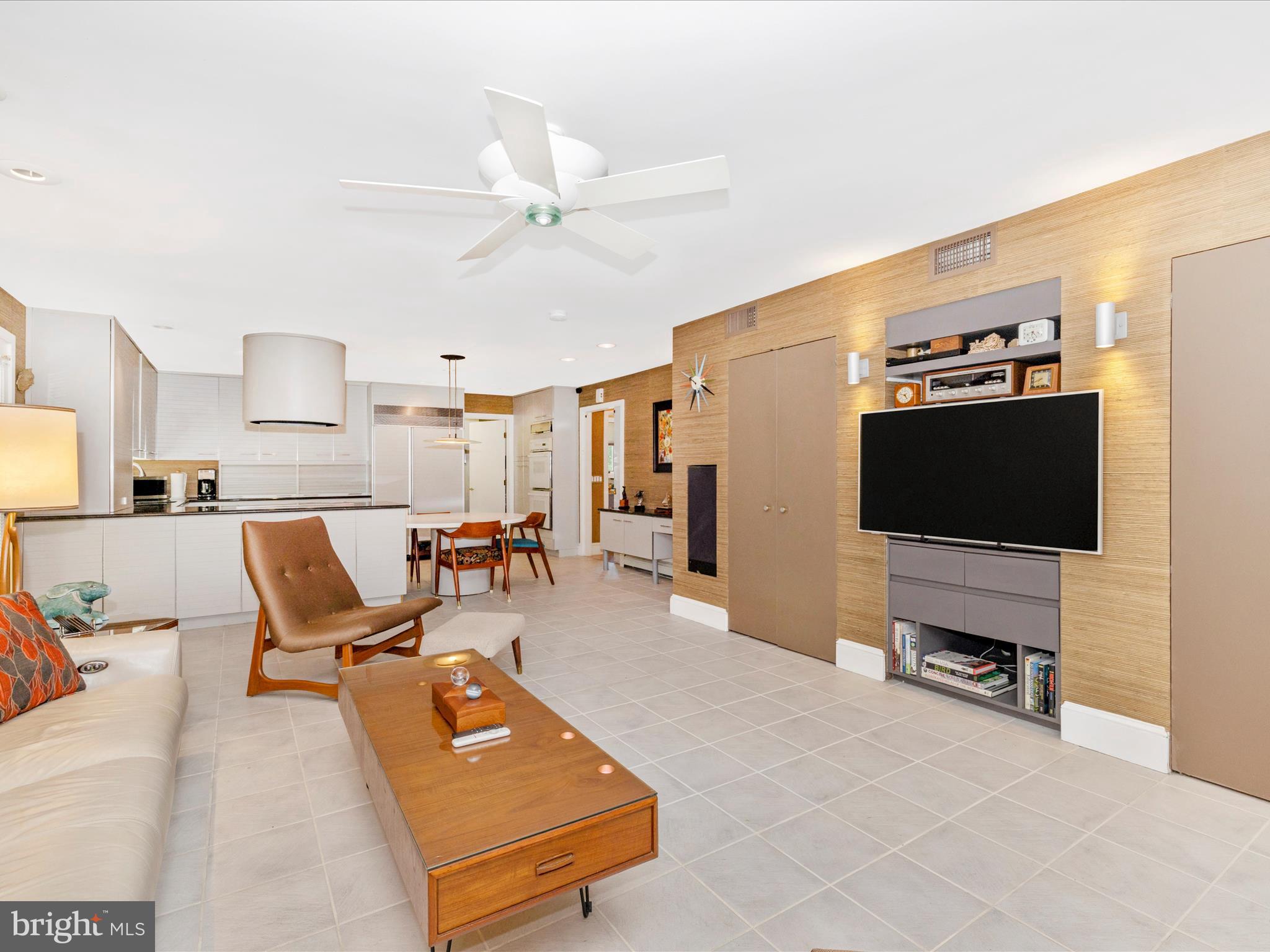 8207 Marcie Drive Baltimore, MD 21208 - Photo 28 of 67 a living room with furniture and a flat screen tv