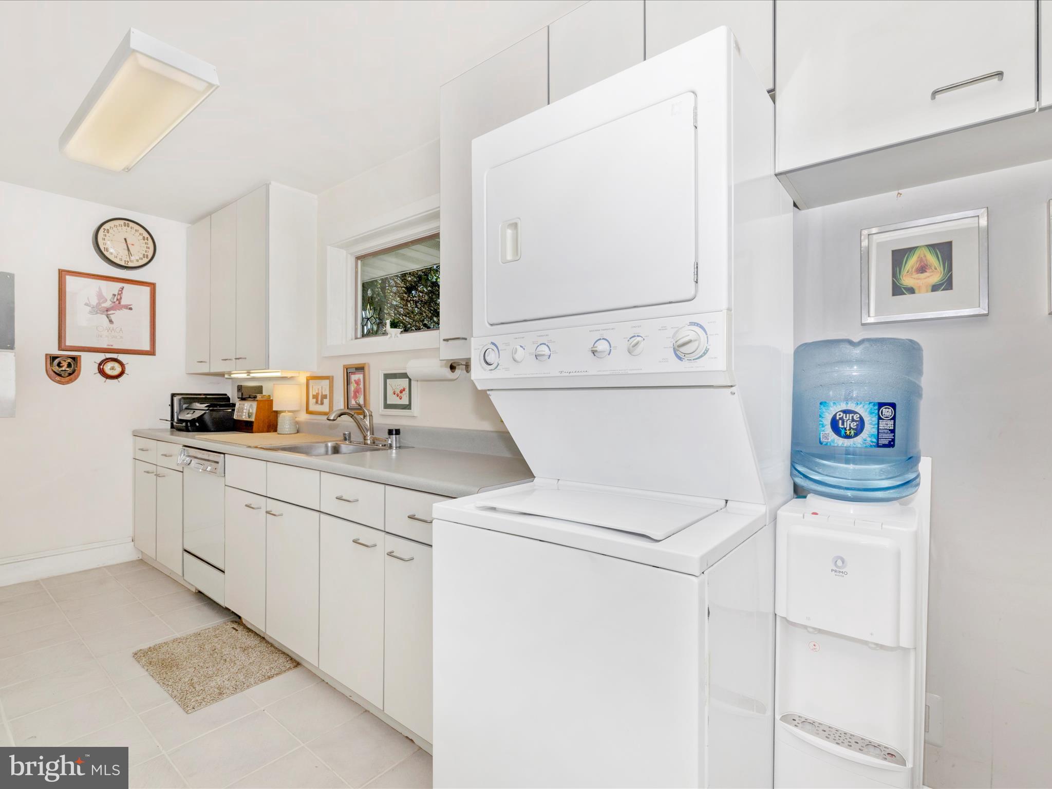 8207 Marcie Drive Baltimore, MD 21208 - Photo 29 of 67 a utility room with sink dryer and washer