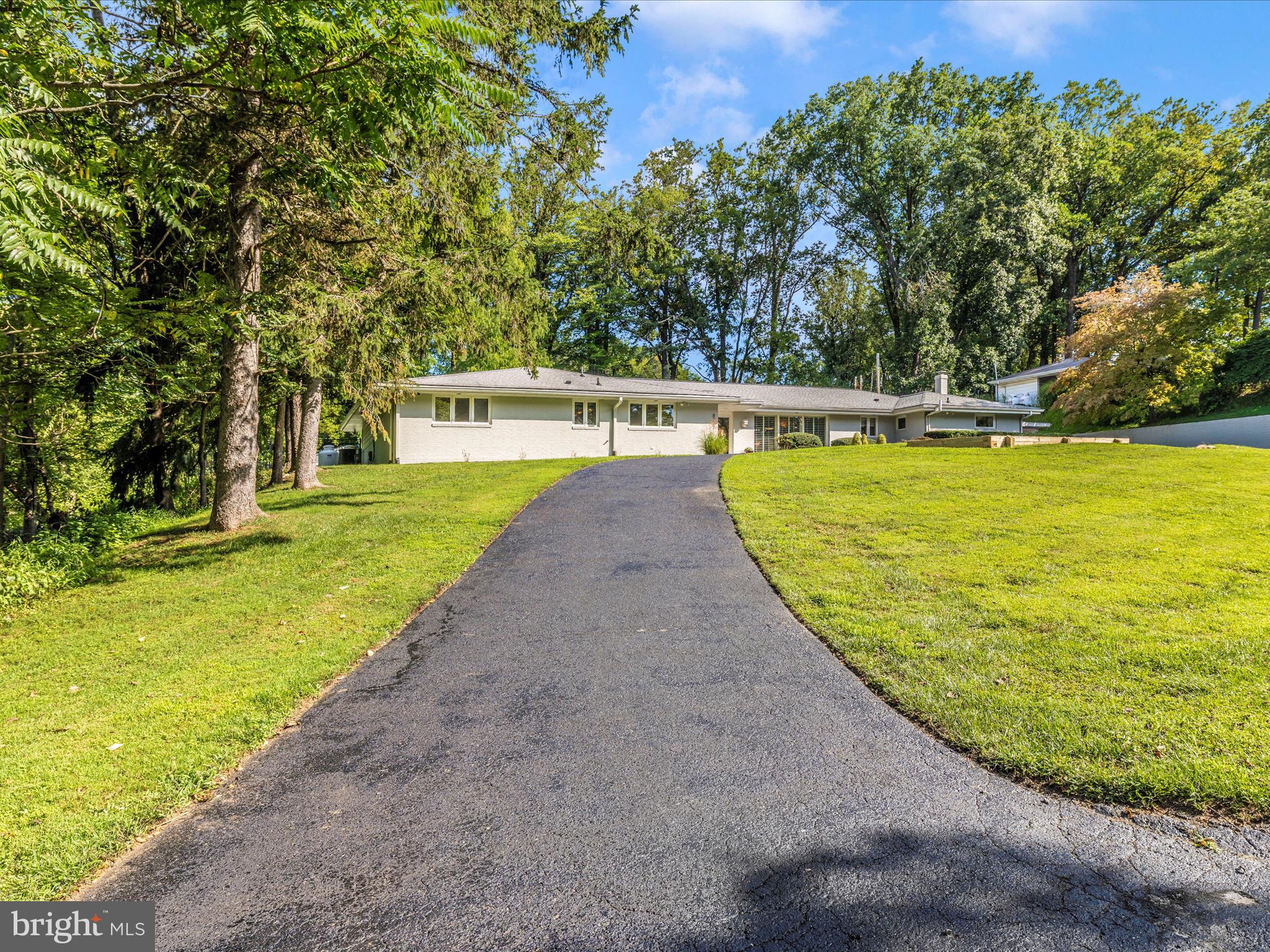 8207 Marcie Drive Baltimore, MD 21208 - Photo 3 of 67 a view of a swimming pool with an outdoor space and seating area