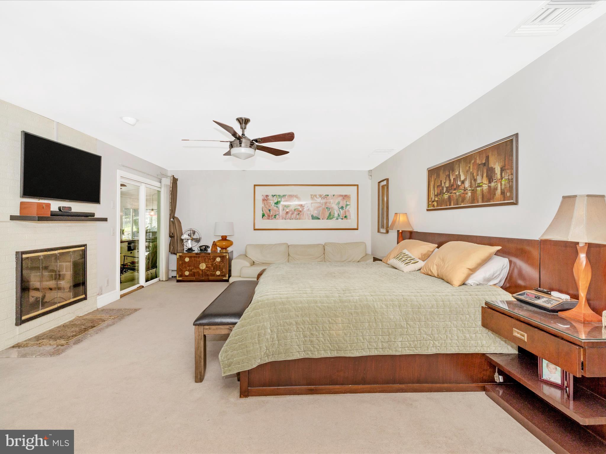 8207 Marcie Drive Baltimore, MD 21208 - Photo 35 of 67 a bedroom with a bed and a flat screen tv