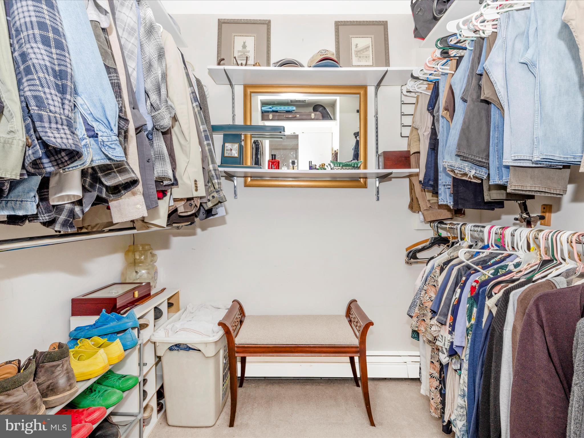 8207 Marcie Drive Baltimore, MD 21208 - Photo 41 of 67 a view of walk in closet with clothes and shoes