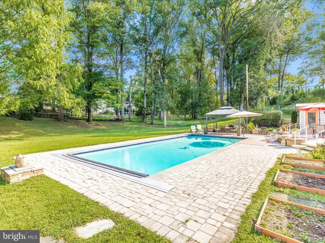 a view of house with outdoor space and seating area