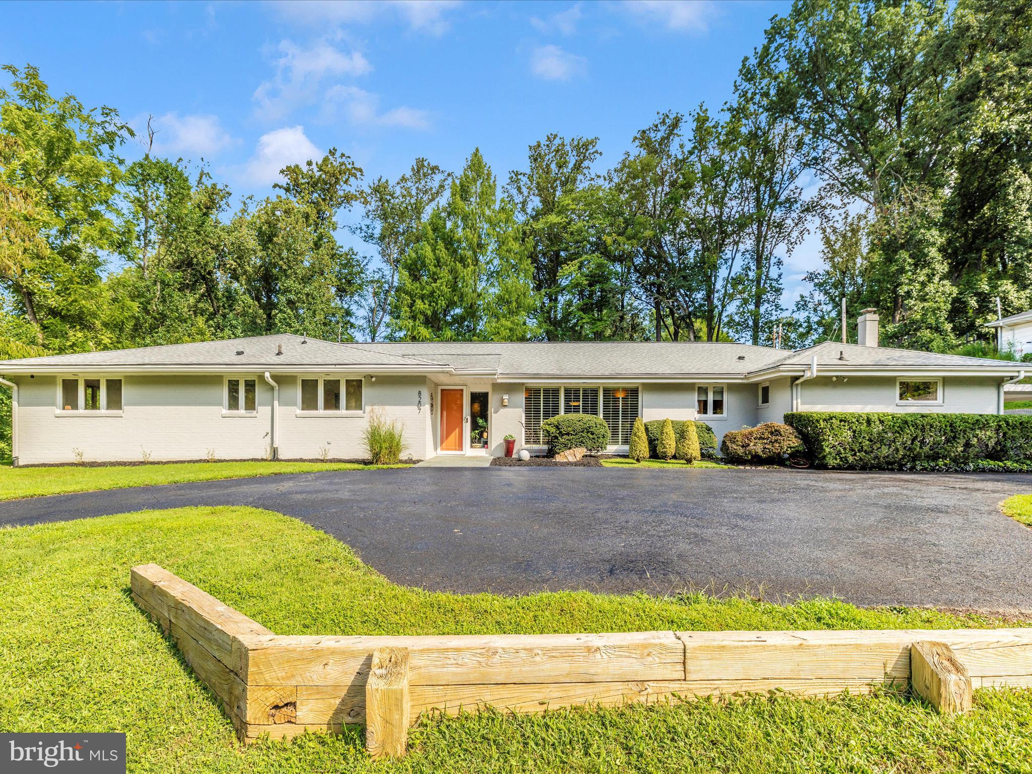 8207 Marcie Drive Baltimore, MD 21208 - Photo 5 of 67 a front view of a house with a yard