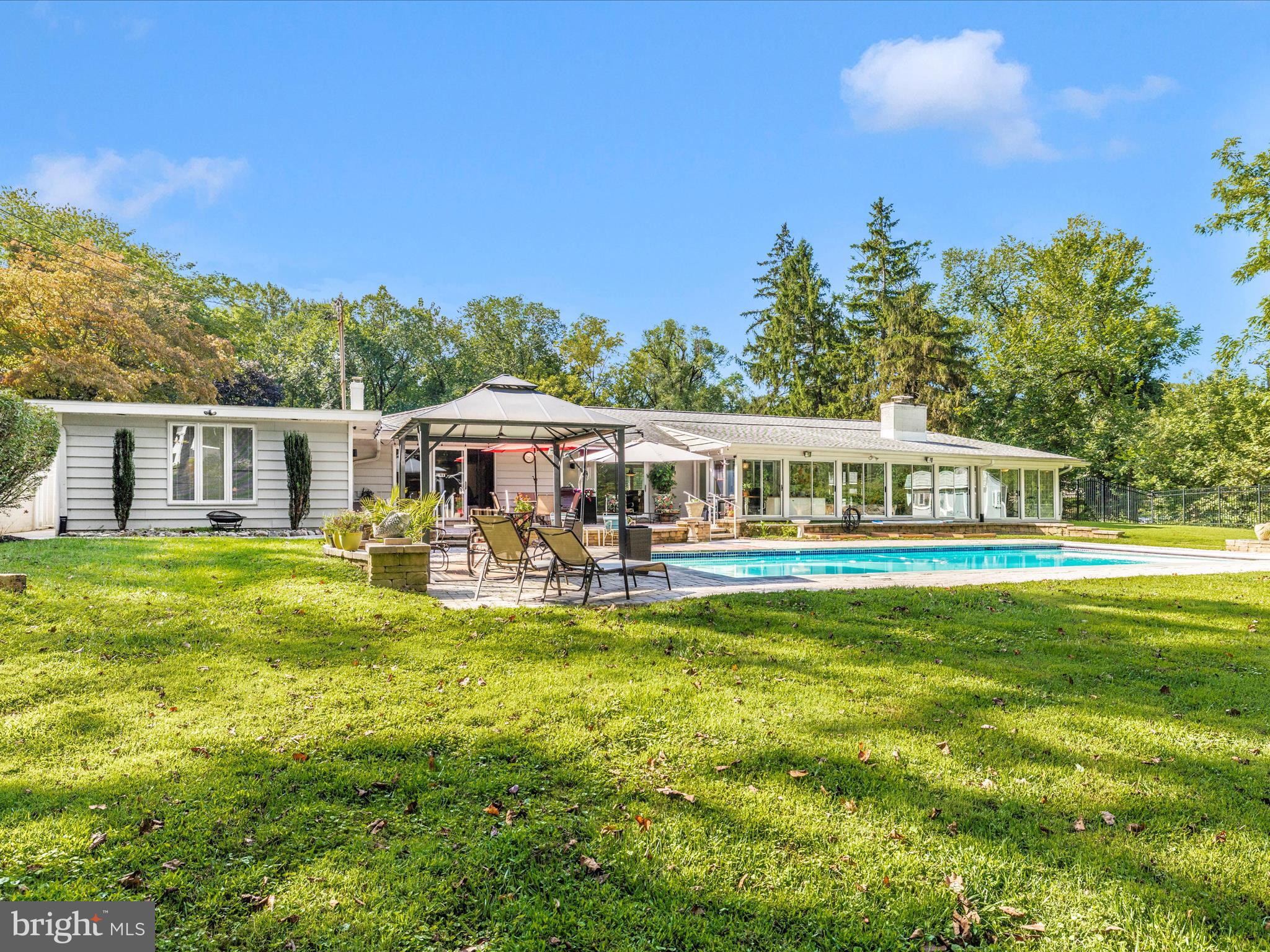 8207 Marcie Drive Baltimore, MD 21208 - Photo 53 of 67 a front view of a house with swimming pool having outdoor seating