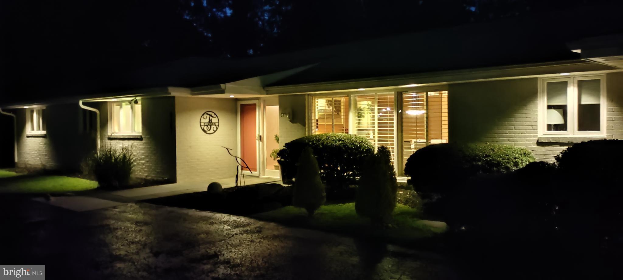 8207 Marcie Drive Baltimore, MD 21208 - Photo 61 of 67 a front view of a house with garden