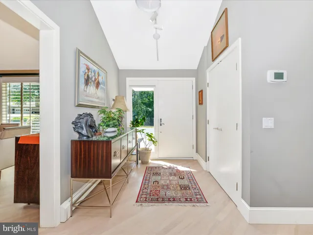 a view of an entryway with wooden floor