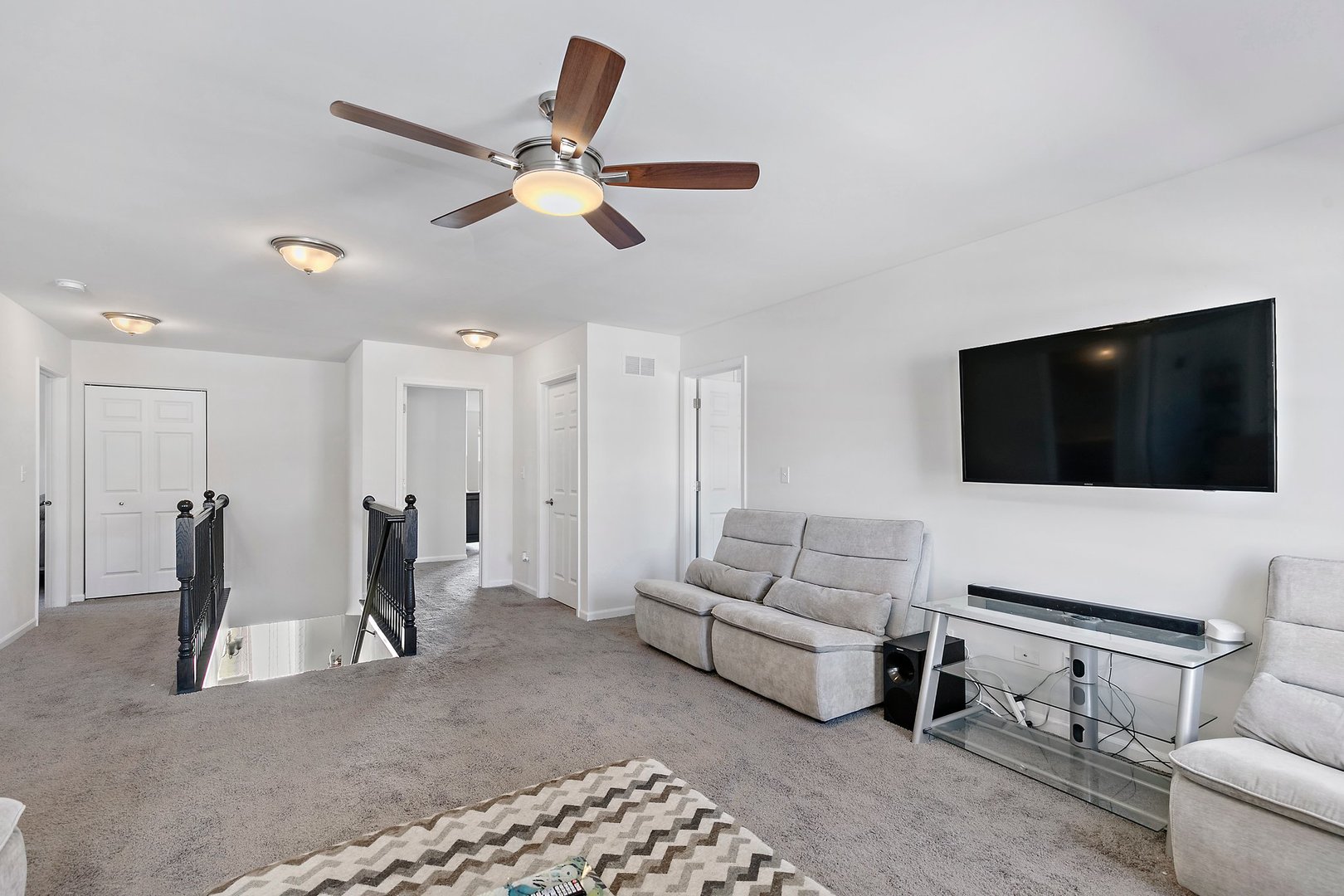 335 Snowdrop Lane Elgin, IL 60124 - Photo 15 of 25 a living room with furniture and a flat screen tv