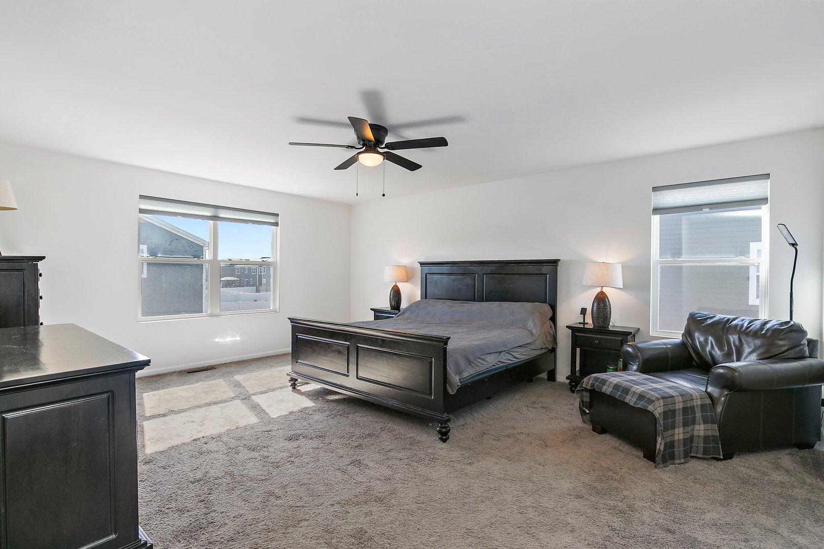 335 Snowdrop Lane Elgin, IL 60124 - Photo 16 of 25 a bedroom with a bed a couch and a window