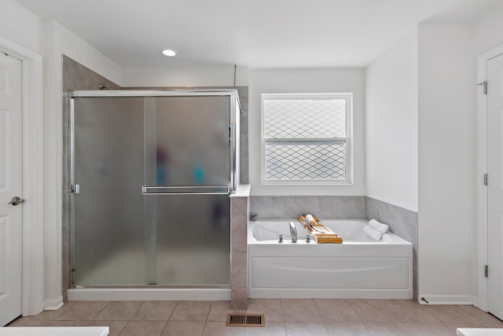 335 Snowdrop Lane Elgin, IL 60124 - Photo 18 of 25 a bathroom with a bathtub and a shower