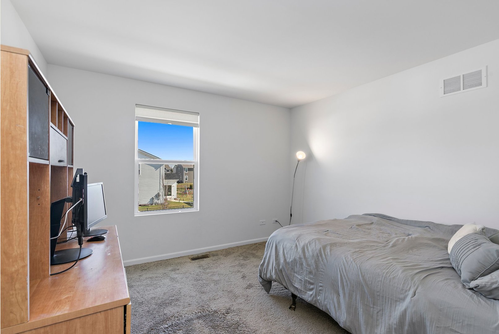 335 Snowdrop Lane Elgin, IL 60124 - Photo 22 of 25 a bedroom with a bed and a flat screen tv