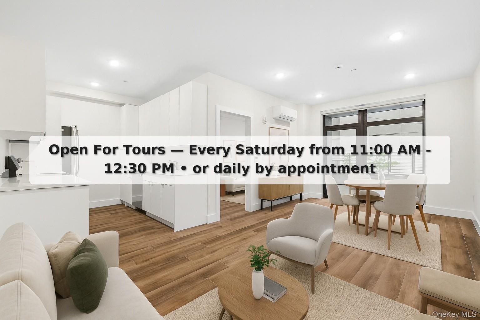 a living room with furniture a rug and white walls