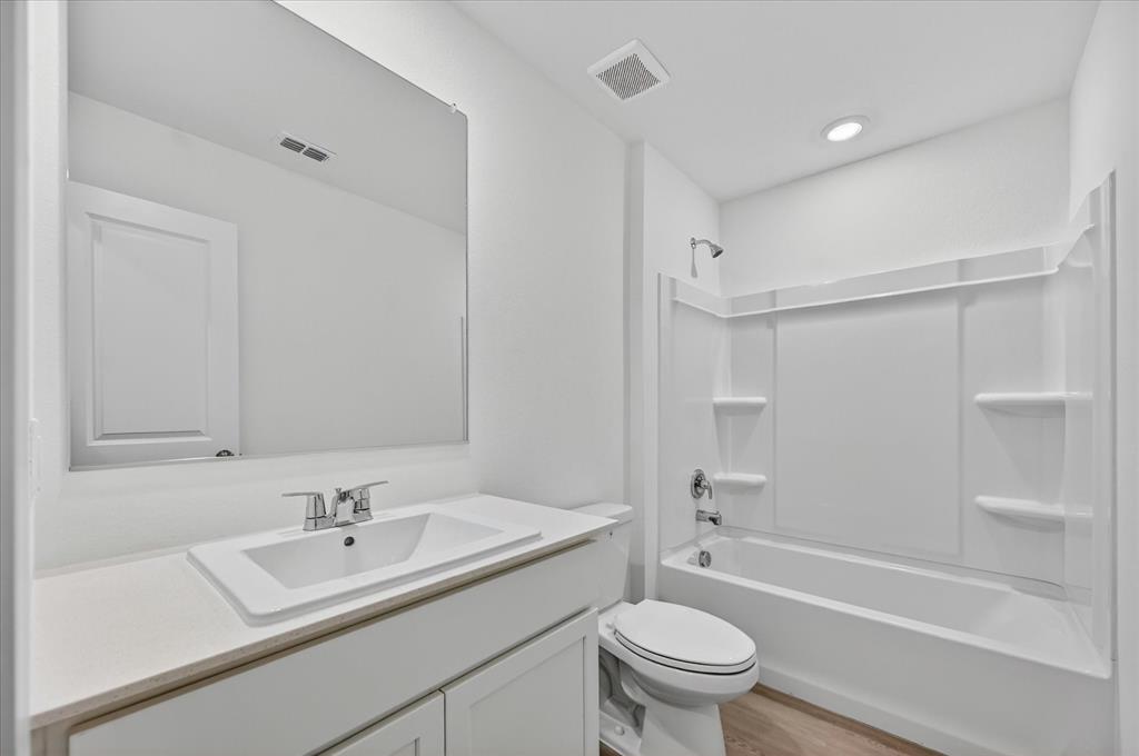 1516 Prince Road Howe, TX 75459 - Photo 11 of 28 a bathroom with a sink toilet and shower