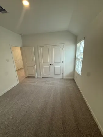 a bathroom with a double vanity sink toilet and shower