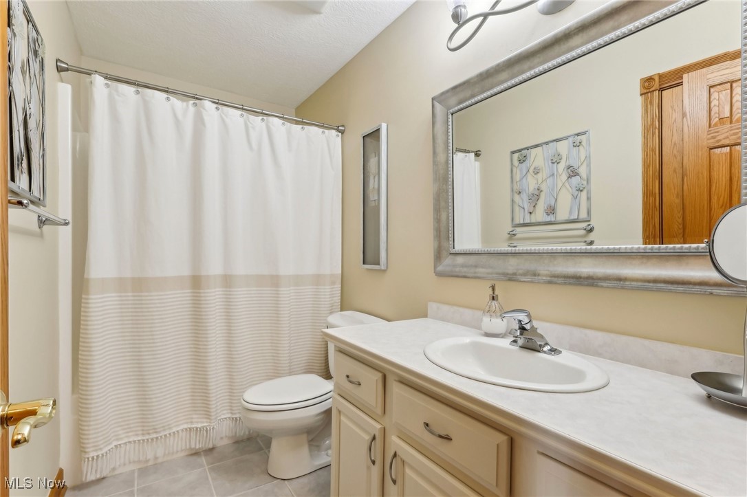 3353 Jens Way Perry, OH 44081 - Photo 20 of 49 Bathroom featuring vanity, toilet, and tile patterned flooring