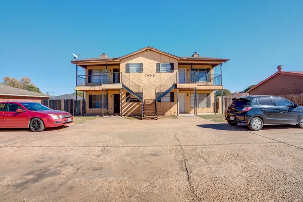 a view of a car in front of a house