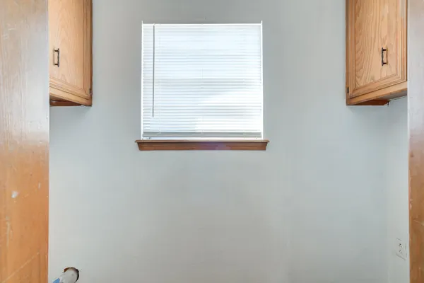 a kitchen with stainless steel appliances granite countertop a sink and a white cabinets