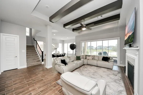 a living room with fireplace furniture and a fireplace
