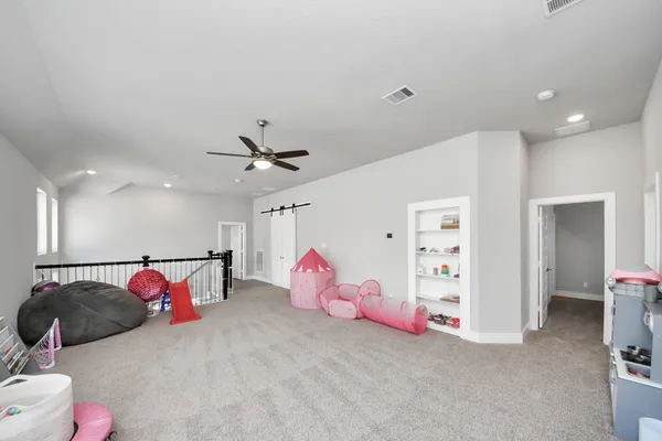 a bedroom with furniture and a couch